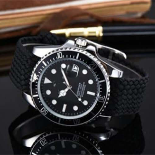 Unisex waterproof black watch with a round dial, quartz movement, and titanium pin buckle.