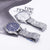 Stylish men's quartz wrist watches with round dials and stainless steel bands, featuring a modern design.
