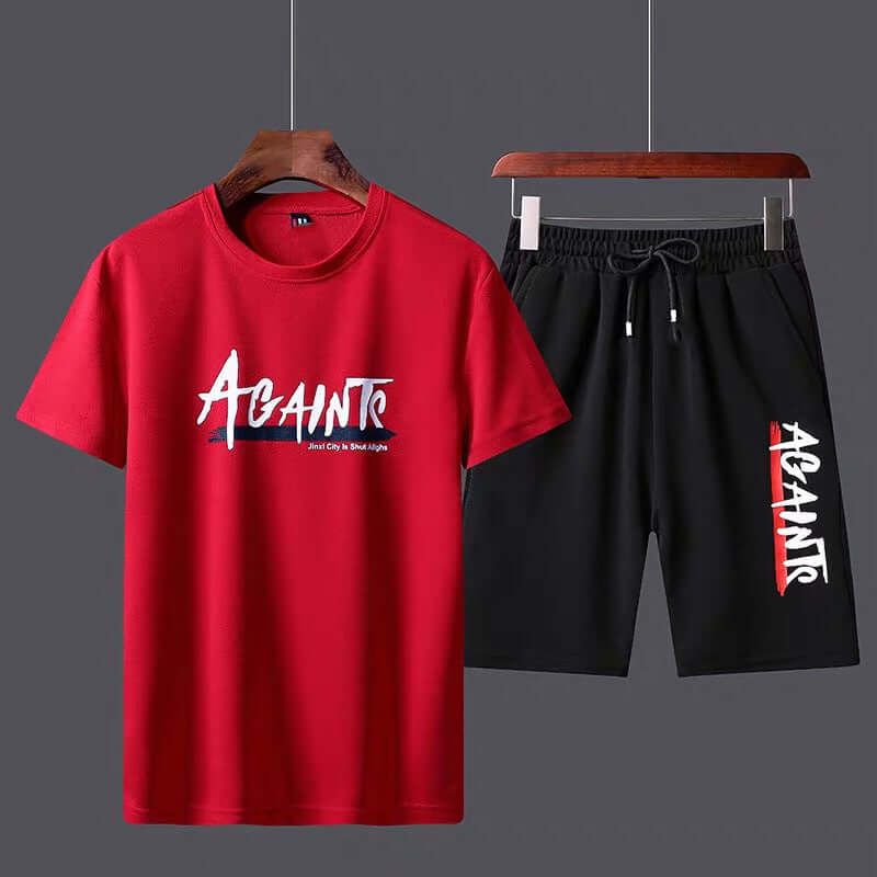 Twopiece sportswear set featuring a red T-shirt with 'Against' print and black shorts, perfect for casual wear.