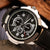 Men's quartz watch with black dial and stainless steel case, showcasing chronograph features and a durable PU strap.