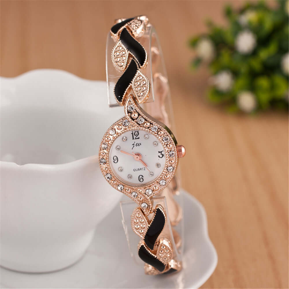 Trendy quartz watch with leaf design, rose gold accents, and black band, decorative style without waterproof function.