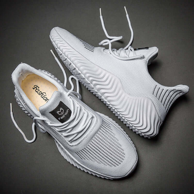 Stylish sports casual shoes with mesh cloth inner material in white color, perfect for everyday wear.