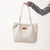 Creamy-white corduroy tote bag for women with double straps, ideal for autumn and winter daily outfits.