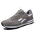 Mens casual running shoes in gray with white accents, featuring a low profile and rubber sole.